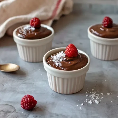 Final dish close-up of creamy 5-Ingredient Chocolate Avocado Pudding (GF + DF) in a small ramekin with smooth texture and soft natural light.