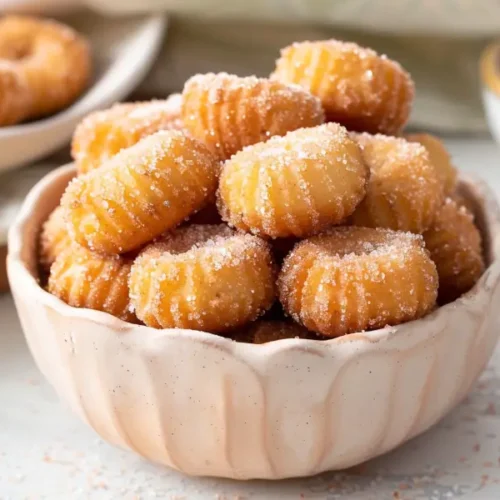 10 Best Gluten and Dairy Free Desserts to Impress Guests 19 Cinnamon Churro Bites (Baked, GF/DF) in a close-up golden cinnamon-sugar coating.