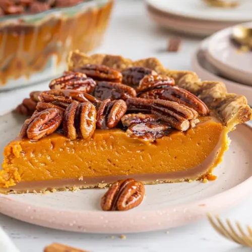 The Best Easy Gluten Free Thanksgiving Desserts for a Crowd 11 Sweet Potato Pecan Pie slice with toasted pecan topping and smooth orange-gold filling.